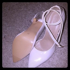 Nude strappy pumps